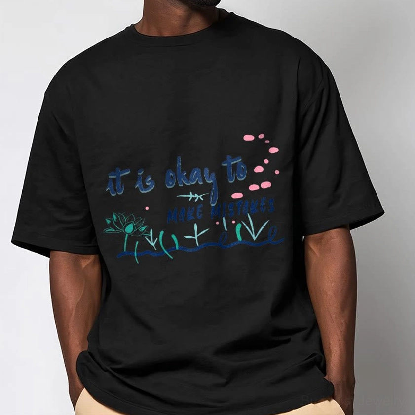 Male model wearing black Buddhist wisdom tee with khaki pants side profile studio