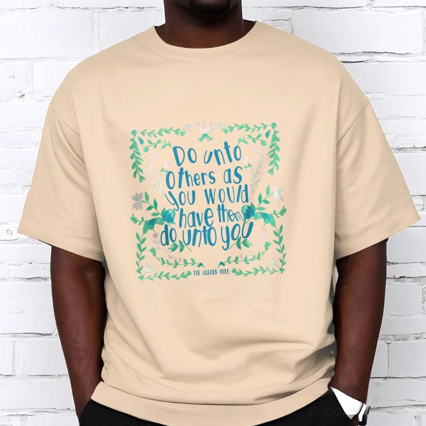 Buddhist compassion graphic tee featuring golden rule text with ornamental floral elements spiritual design