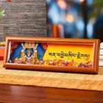 Buddhist thangka photo frame with amethyst citrine crystals and sacred mantra on wooden table