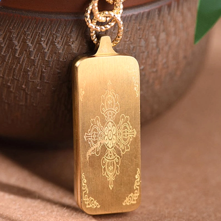 Back view of titanium steel thangka pendant showing engraved vajra pattern and smooth metal surface