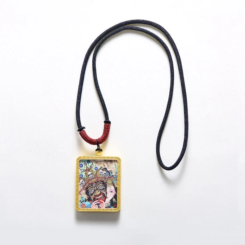 Buddhist Thangka pendant on white background showing gold frame with detachable pendant design and cord