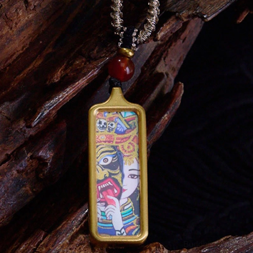 Hand-painted Buddhist thangka pendant necklace with gold frame, red agate bead and twisted silver cord, front close-up view