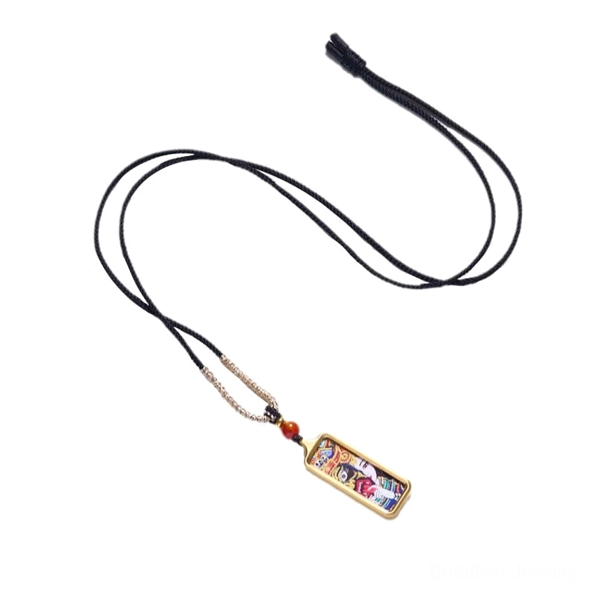 Full Buddhist thangka pendant necklace with black braided cord, small gold-framed thangka and red accent bead on white background