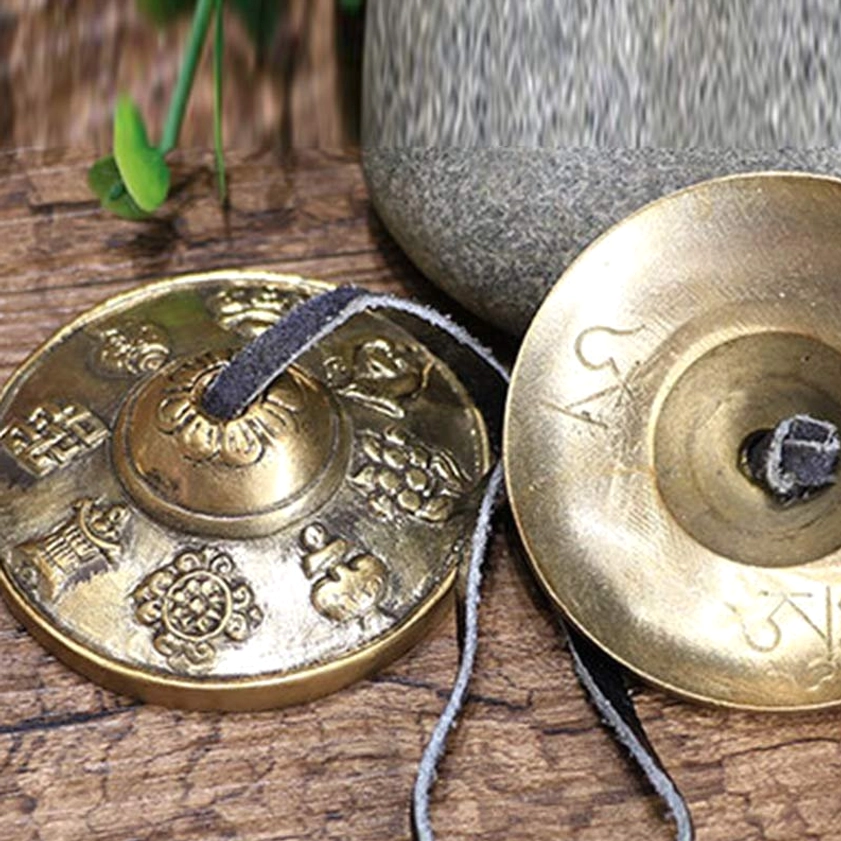 Authentic Buddhist tingsha cymbals showing craftsmanship details and spiritual symbolism