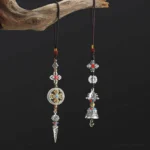 Buddhist Vajra Bell car hanging ornament featuring sacred symbols and Om Mani Padme Hum mantra with red accents on braided rope