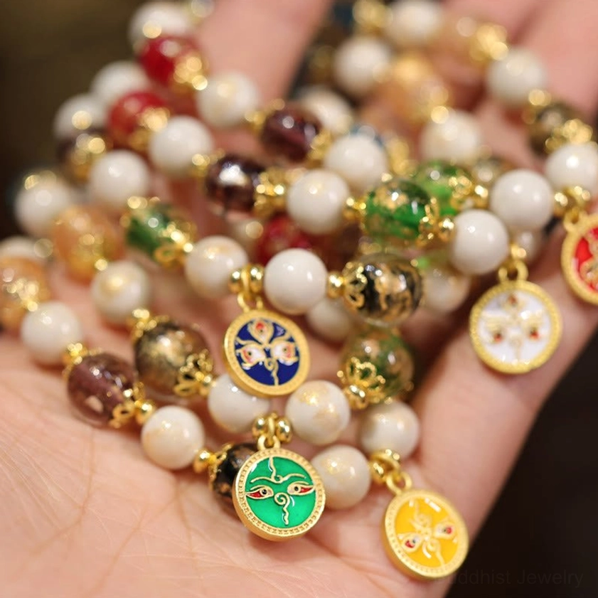 Loose Five Gods of Wealth Buddhist bracelets held in palm showing multiple cloisonne pendants and glass beads