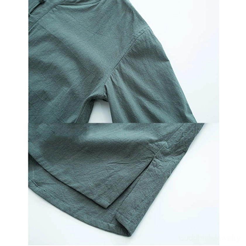 Side view of men's Buddhist meditation garment showing relaxed sleeve fit and split side hem detail