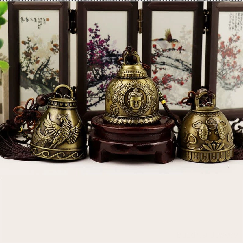 Three handcrafted feng shui wind chimes with vintage bronze tone and unique engraved spiritual designs