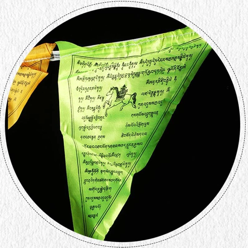 Buddhist Windhorse prayer flags detail showing sacred imagery and hand-printed mantras in traditional design