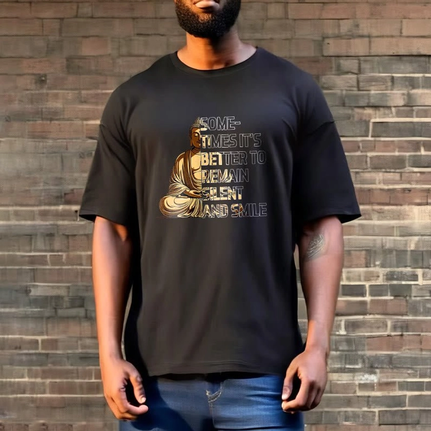 Full body male model styling black Buddhist graphic tee with brick wall background, streetwear mindfulness apparel