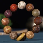 Buddhist zodiac carved wooden bracelet with 12 zodiac animal symbols in rosewood, green sandalwood, and ebony wood beads, featuring Chinese character engravings and wooden lucky buckle
