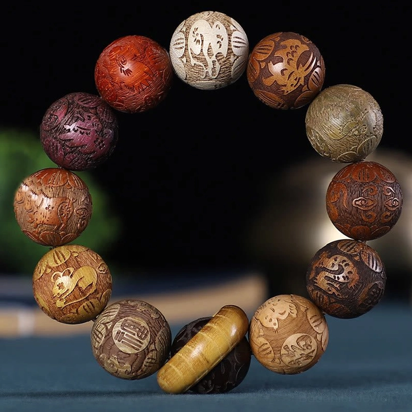 Buddhist zodiac carved wooden bracelet with 12 zodiac animal symbols in rosewood, green sandalwood, and ebony wood beads, featuring Chinese character engravings and wooden lucky buckle