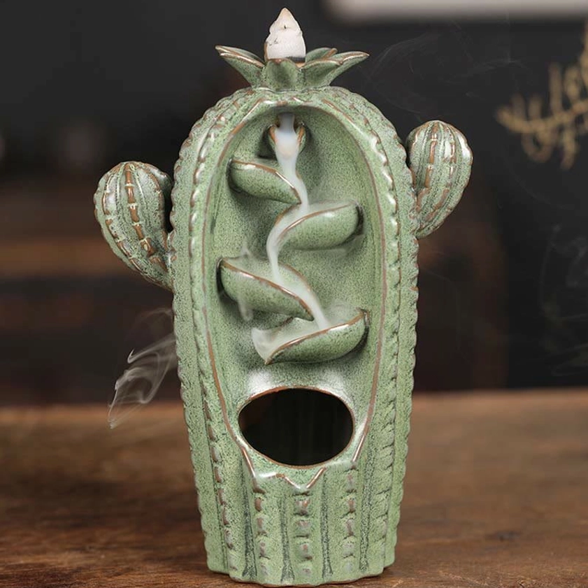 Sage green ceramic cactus backflow incense burner displaying working smoke fountain effect