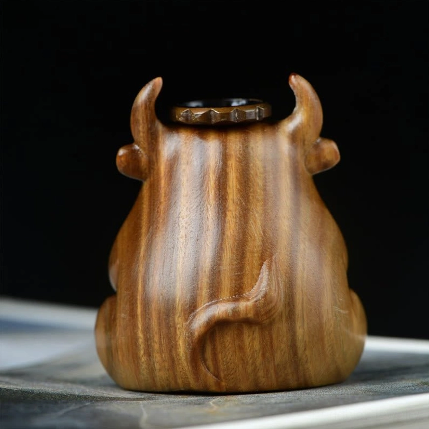 Rear view of handcrafted green sandalwood calf burner showing carved tail and incense cone holder
