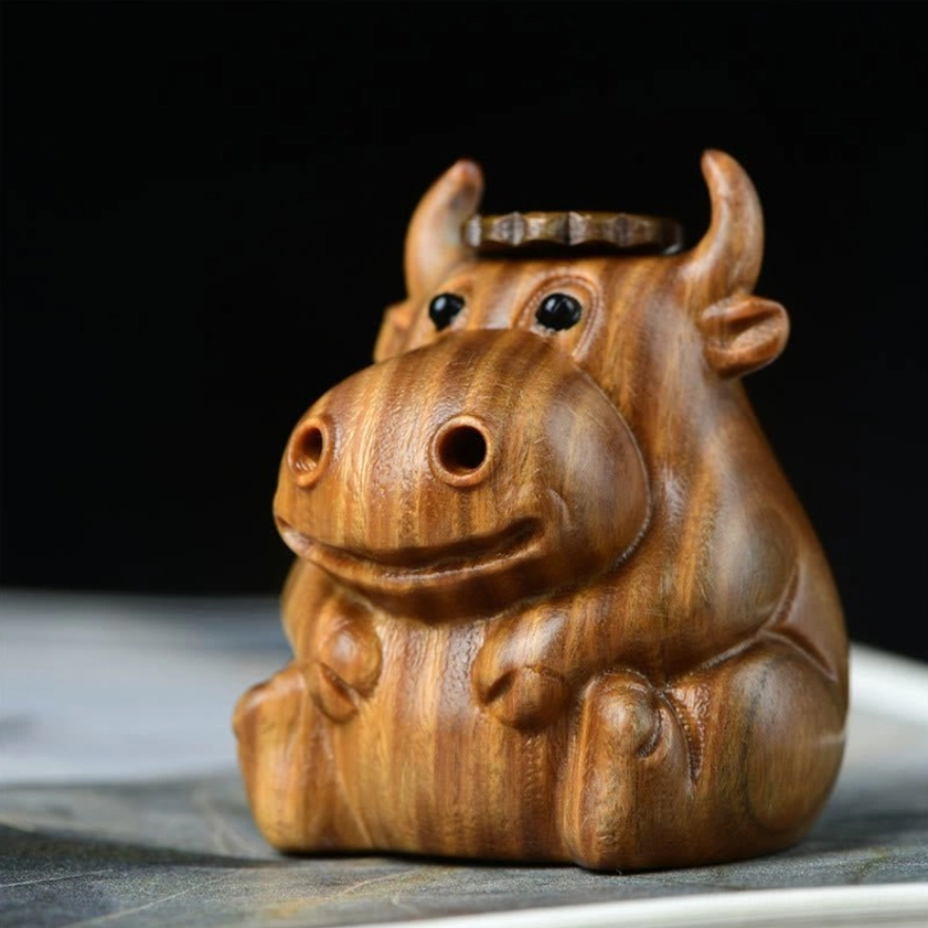 Wooden calf incense burner front view showing natural wood grain and carved details of this Buddhist meditation burner