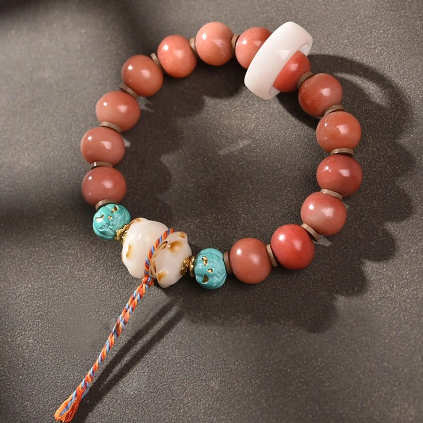 Camel Bone Bodhi Seed Buddhist Charm Bracelet with Turquoise Beads and Braided Tassel, Flat Lay