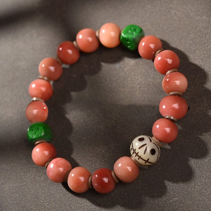 Camel Bone Green Bead Buddhist Bracelet with Decorative Bead, Flat Lay Studio Shot