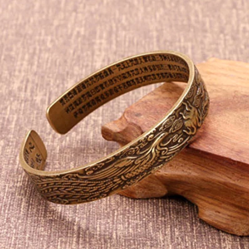 Carved antique brass open cuff bangle with phoenix and sutra engravings