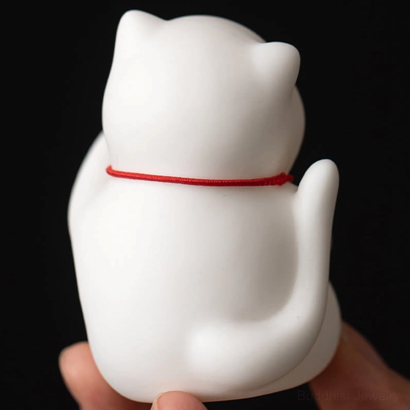 Ceramic cat incense holder with bamboo mat product display and meditation setup styling