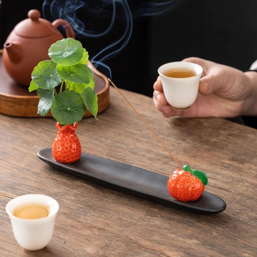 Ceramic Buddhist incense burner and figurine vase set lifestyle display
