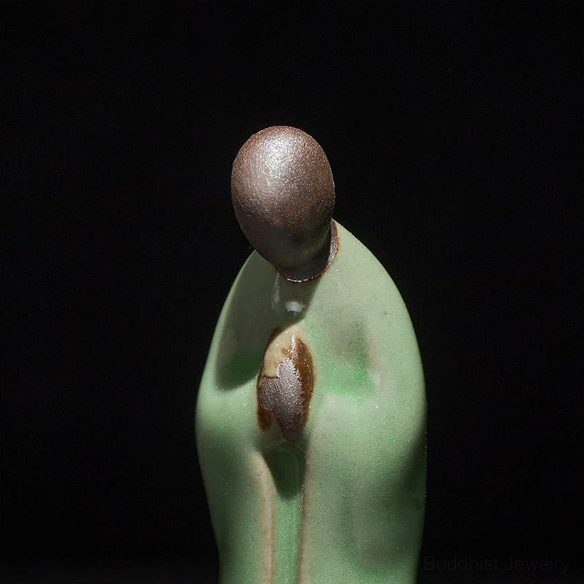 Ceramic Buddhist monk figurine prayer hands clasped devotion pose
