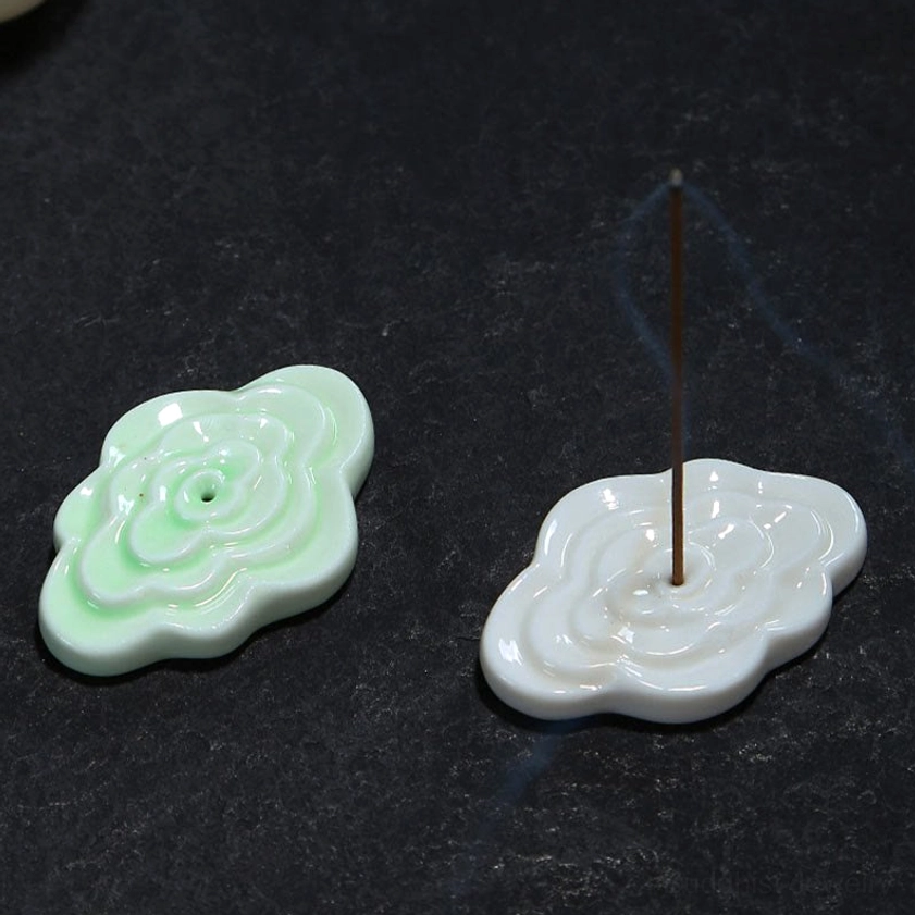 Ceramic cloud incense burner in use during meditation practice, showcasing functional design, fragrant incense burning, and spiritual ambiance creation