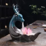 Pink Lotus Ceramic Deer Backflow Incense Burner - Left Three-Quarter View with Flowing Smoke Effect