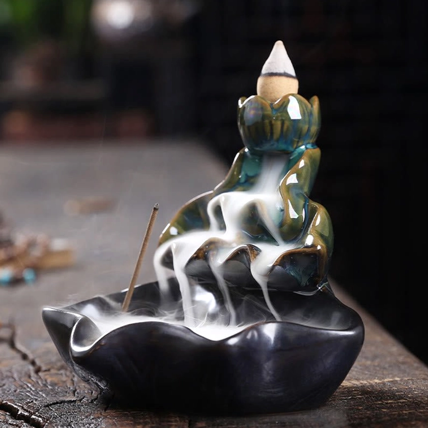 Handcrafted ceramic backflow incense burner with cascading smoke detail