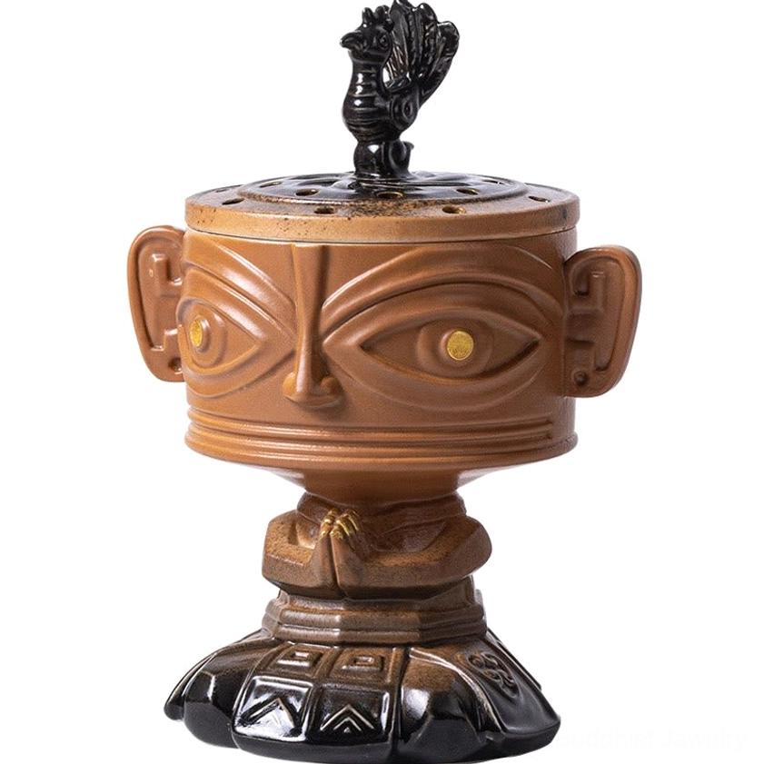 Close-up detailed view of handcrafted ceramic incense burner with carved lid finial and geometric base patterns