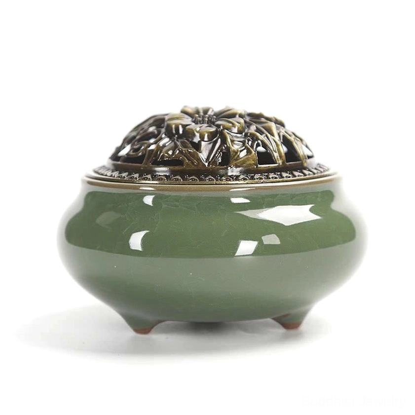 Deep green ceramic incense burner with bronze lid and stable three-footed base