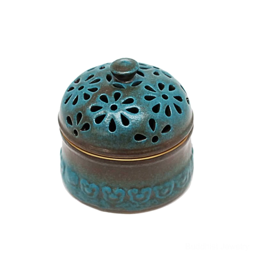 Ceramic incense burner with floral hollow design in teal and brown two-tone finish, perfect for Buddhist meditation and spiritual practice