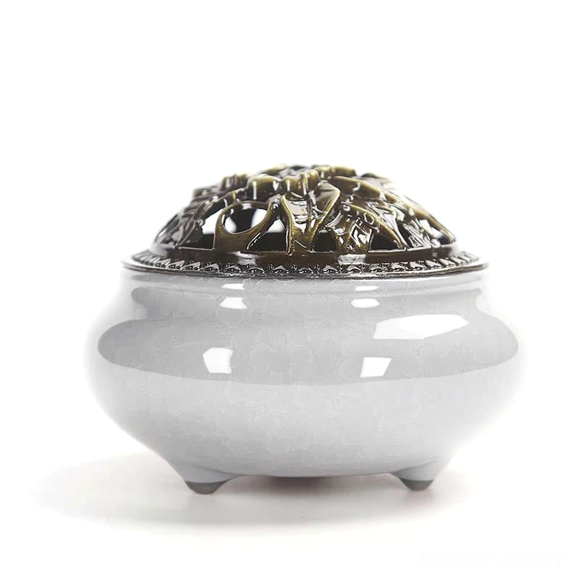 Grey hand-painted ceramic incense burner with three-legged base and floral bronze lid