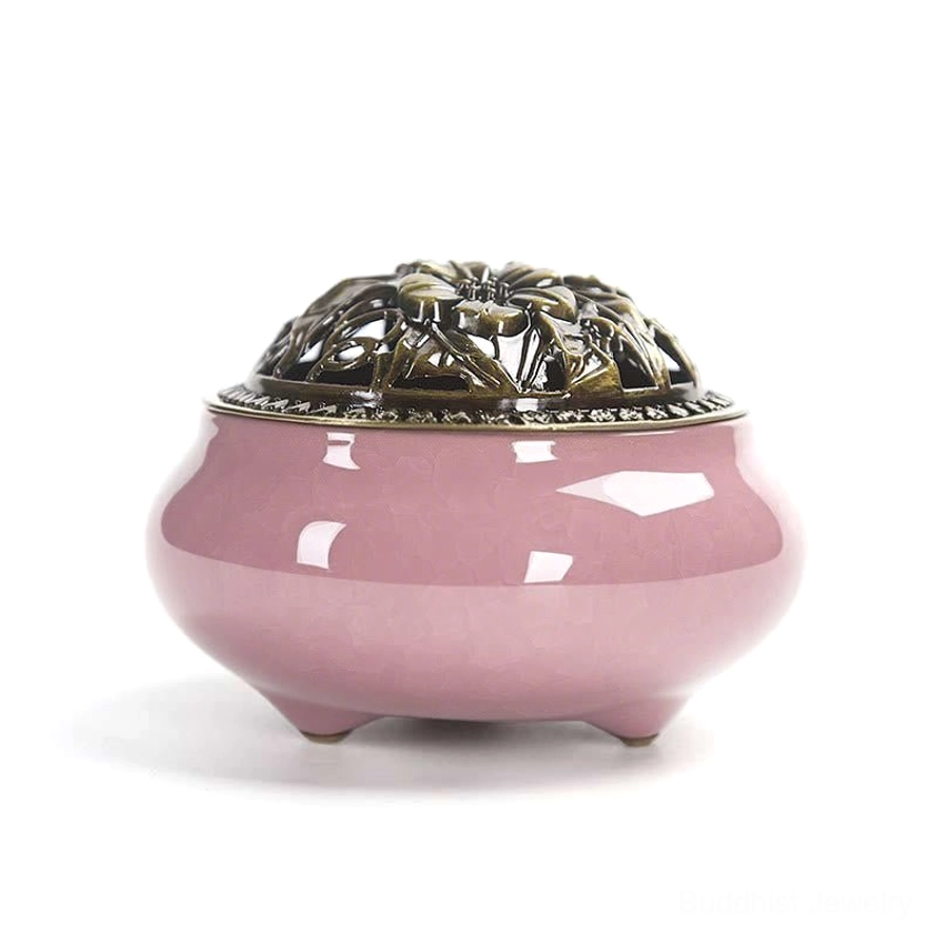 Pink hand-painted ceramic incense burner with bronze hollow lid, three-footed base