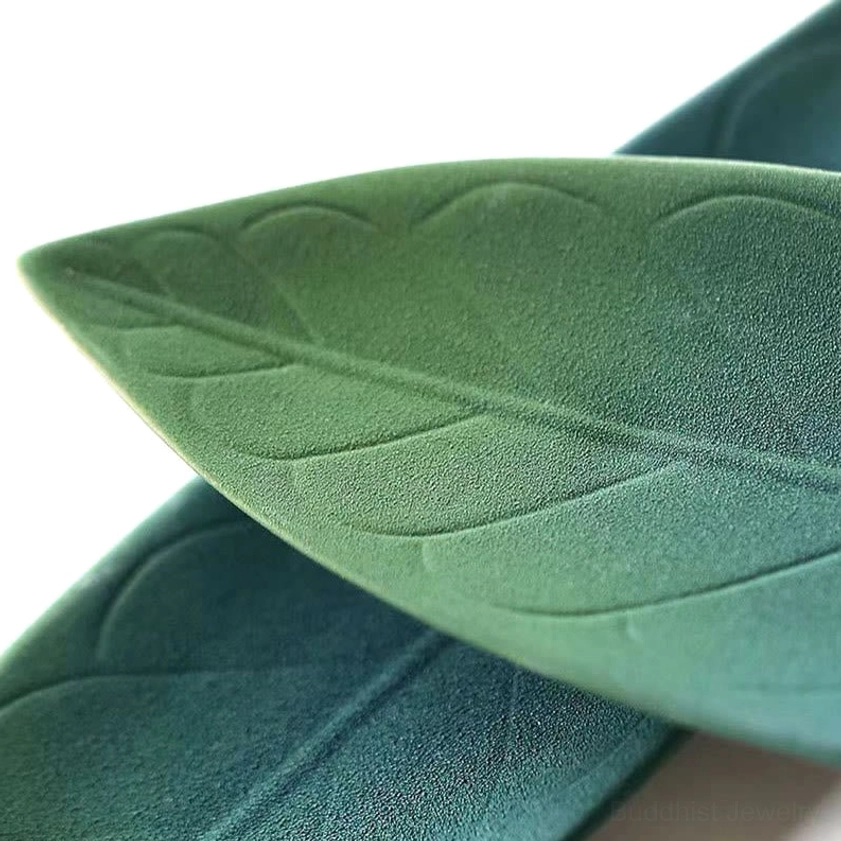Close-up of ceramic willow leaf incense burner with realistic leaf vein texture