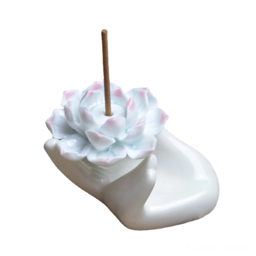 Right front view of mini ceramic lotus incense burner showing small pink-tipped white lotus flower and white hand base with incense stick
