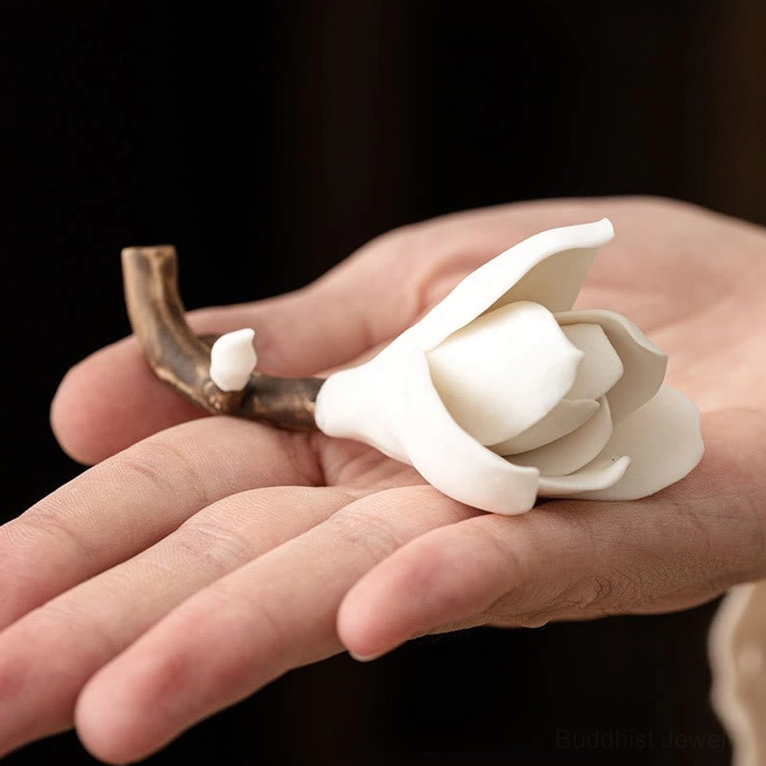Compact ceramic magnolia incense holder held in hand showing portable size, white flower with brown branch design for meditation practice