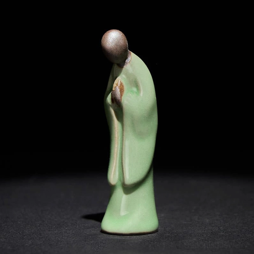 Handcrafted ceramic meditation monk statue with brown glazed head detail