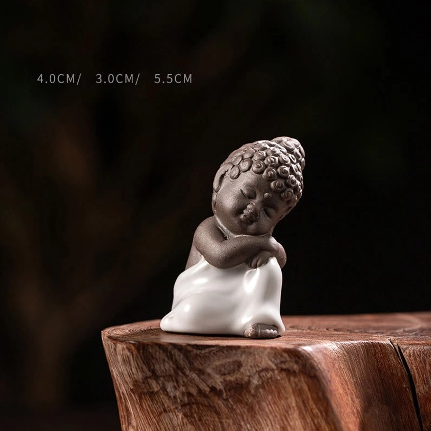 Ceramic meditation monk statue in resting compact pose 4x3x5.5cm handheld design