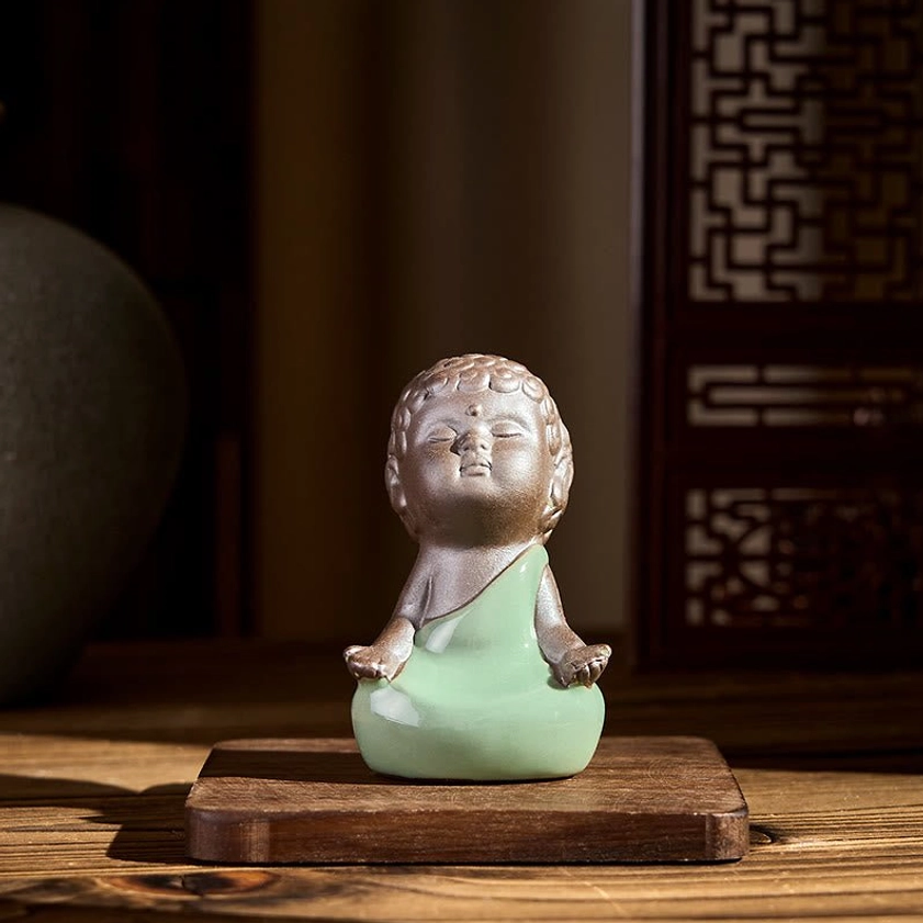 Ceramic meditation monk statue artistic display showing fine craftsmanship details