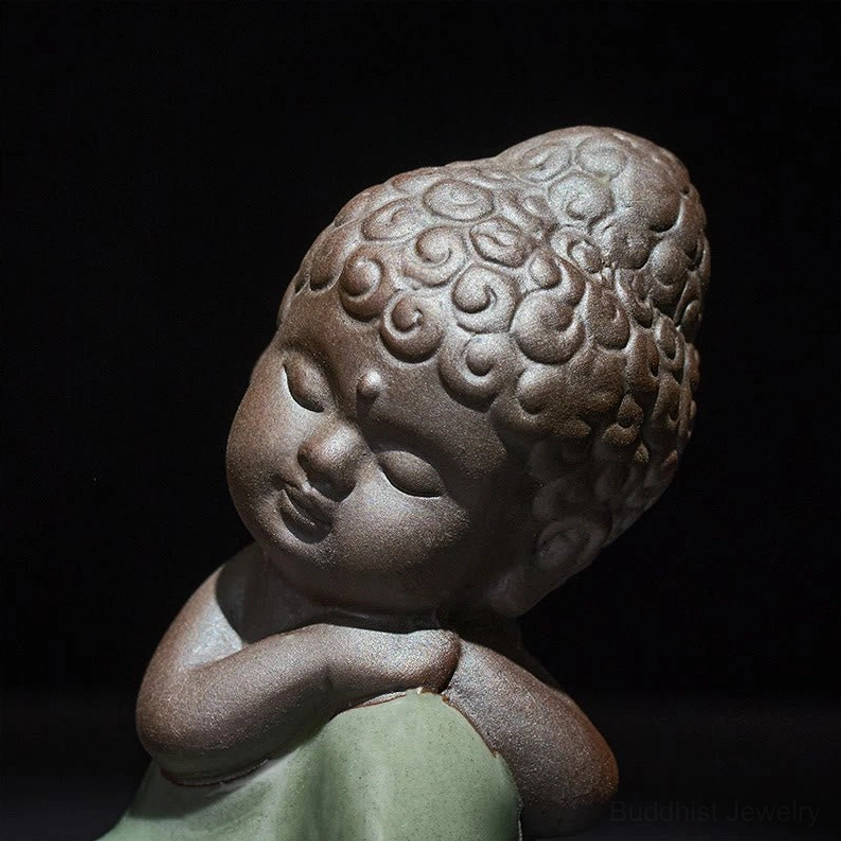 Buddhist ceramic monk figure inspiring mindfulness and spiritual awakening
