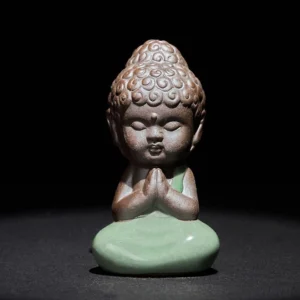 Handcrafted ceramic meditation monk statue in prayer pose with curly Buddha hair and folded hands