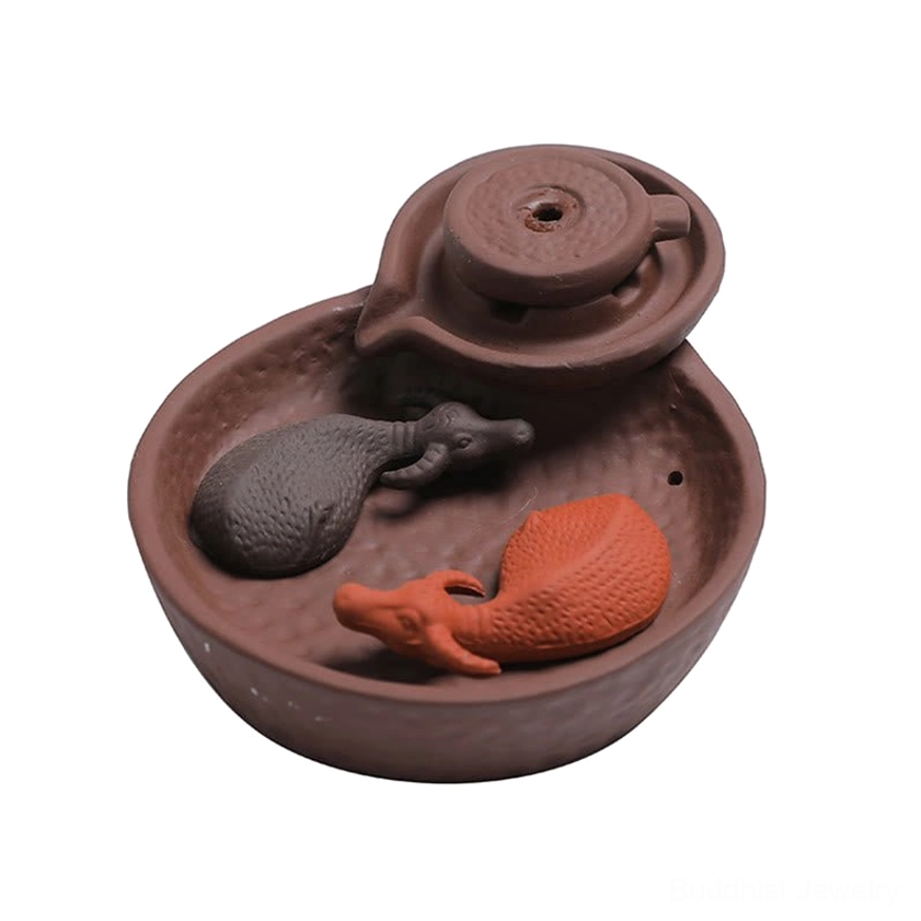 Brown ceramic purple clay incense burner with ox decorations, compact holder design, right side oblique view on white background