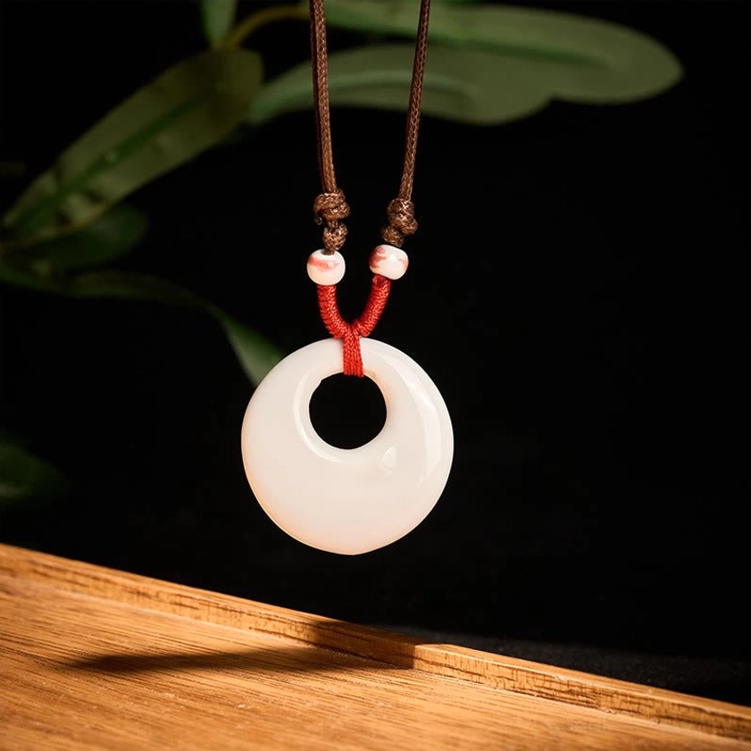 Ceramic pendant necklace full product view showcasing adjustable rope length and pendant design