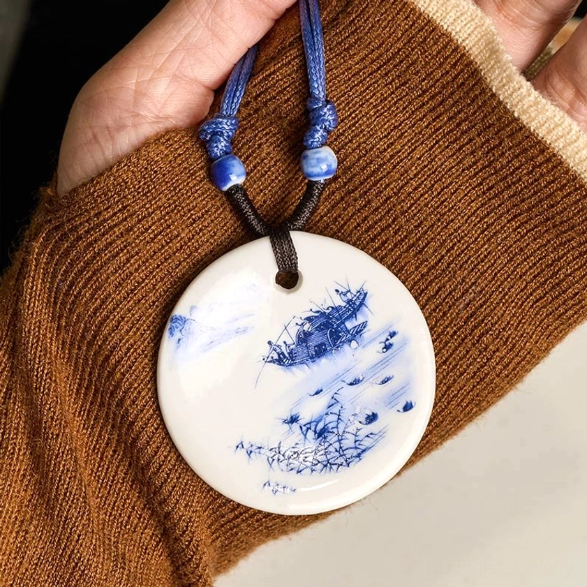 Buddhist ceramic pendant necklace detail view showing natural rope weave and pendant attachment