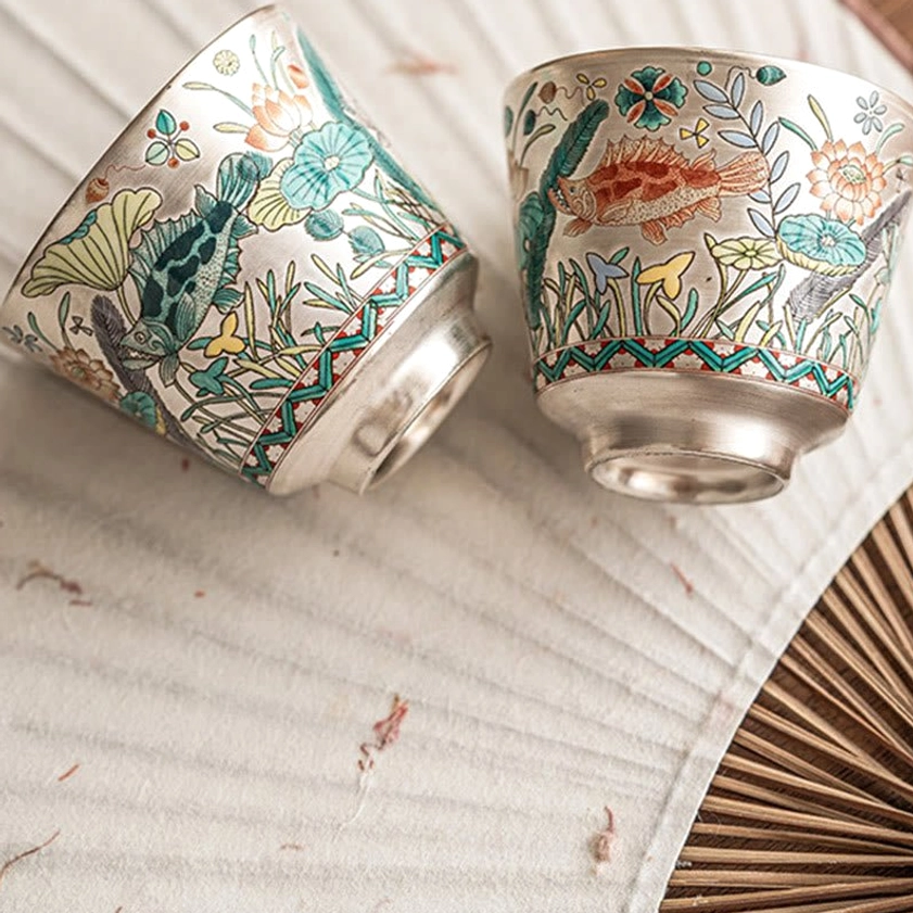 Artisan ceramic teacup 45ml capacity with silver rim and lotus-fish pattern, gift-ready presentation