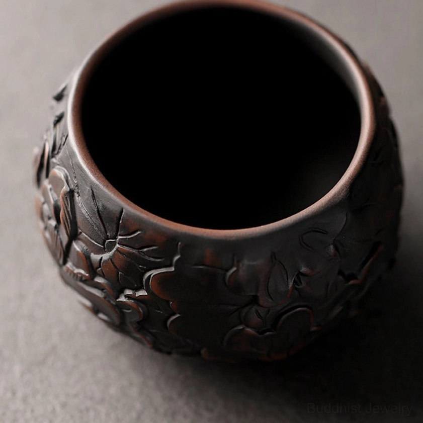 Top-down overhead view of round ceramic tea bowl showing inner cavity and embossed exterior patterns