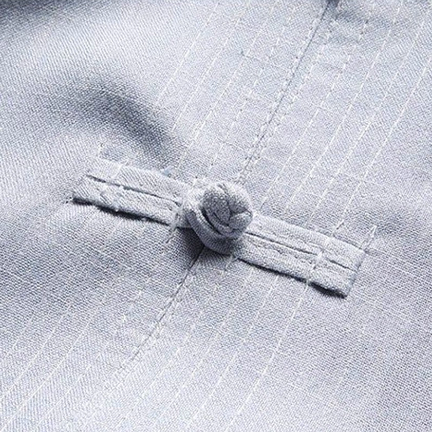 Detailed close-up of Chinese frog button on Tang suit with neat stitching