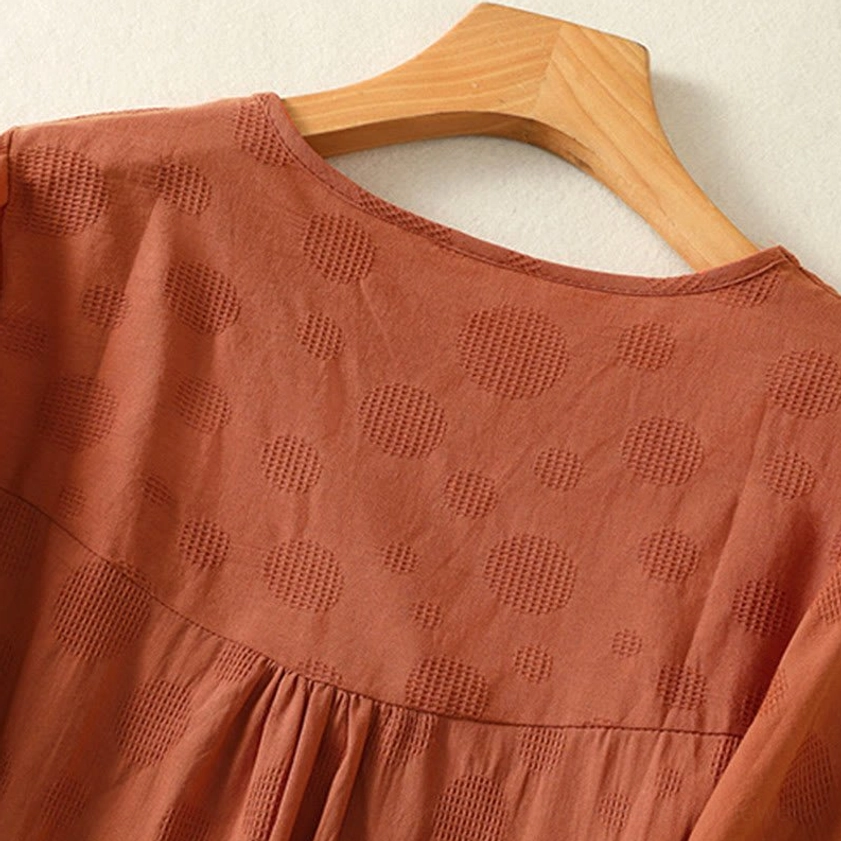 Puffed sleeve detail of chocolate brown meditation yoga blouse - close-up showing construction