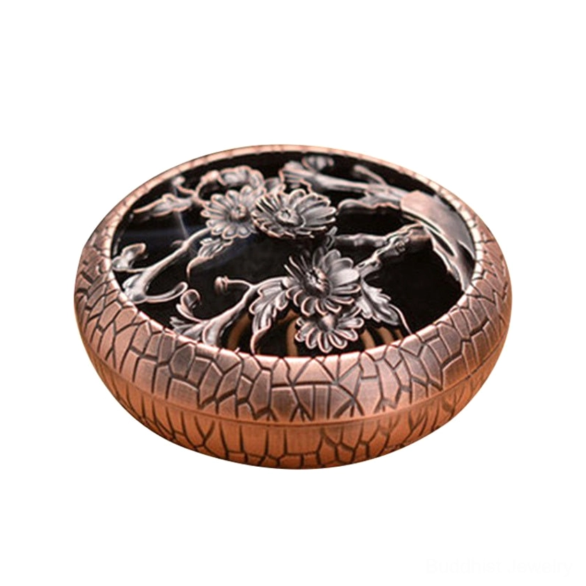Chrysanthemum carved brass incense burner isolated on white background, three-quarter view showing hollow floral lid design and crackle exterior texture