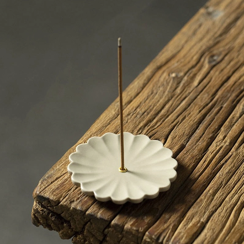 Chrysanthemum ceramic incense burner with radial ribbed petals and metal incense pin for meditation